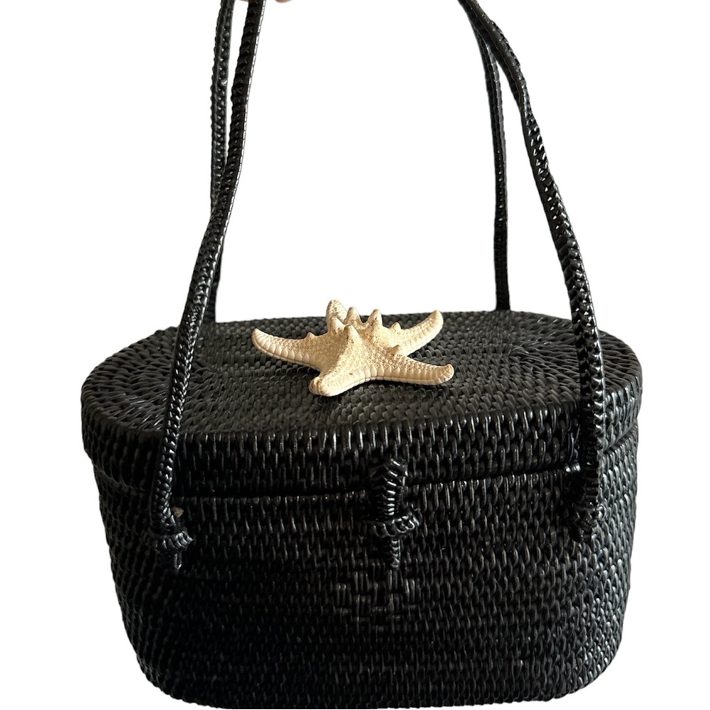 Get ready for summer with this mini straw bag and shell on top.